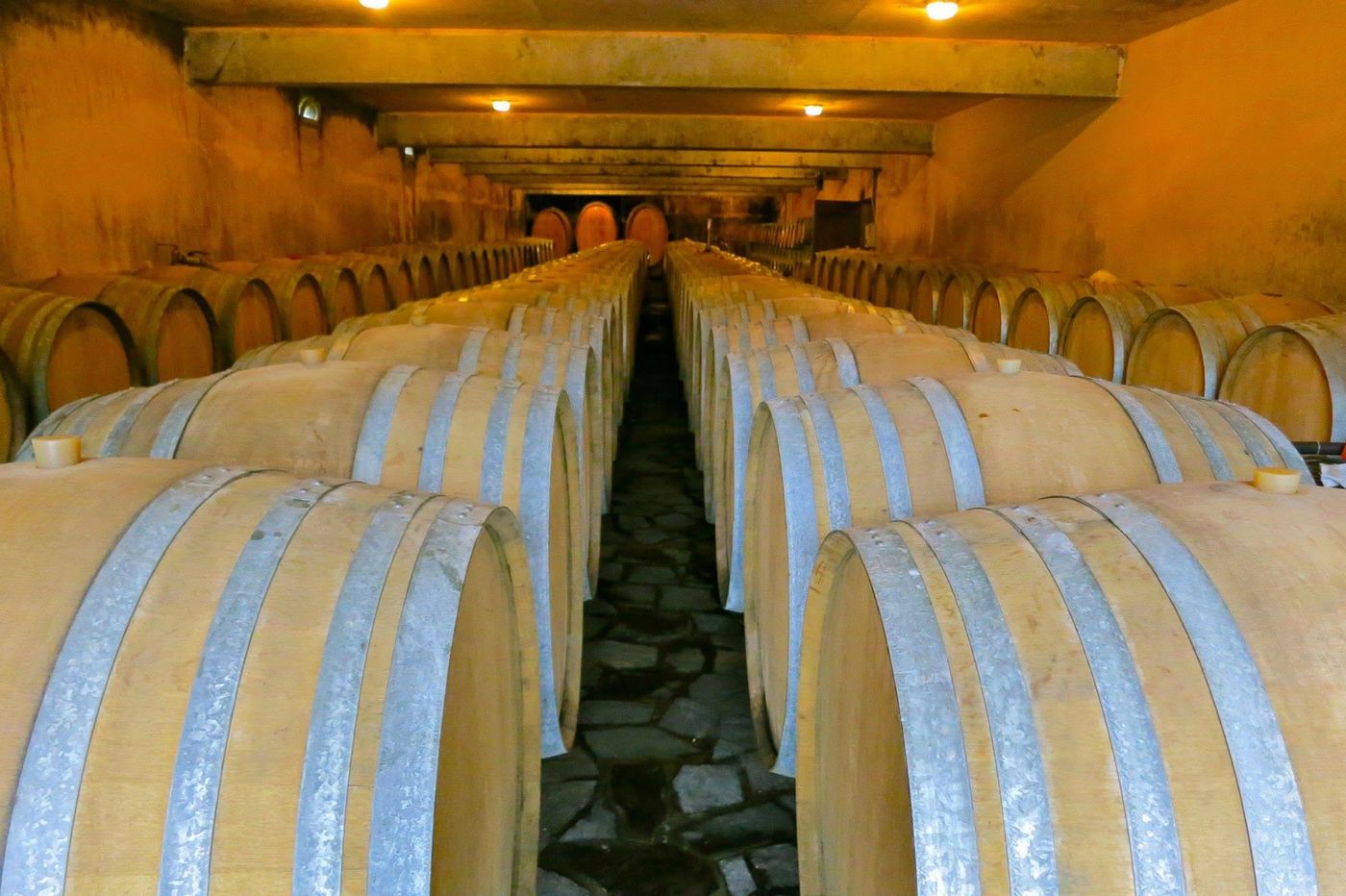 Long rows of barrels on a flagged stone floor